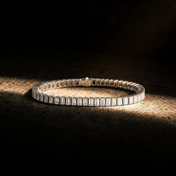Meridian Men's Emerald-Cut Tennis Bracelet, Carat Club Co., on a dark editorial backdrop