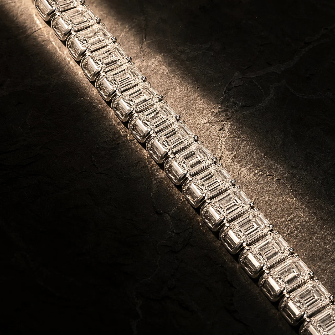 Macro detail of the emerald-cut lab-grown diamonds on the Meridian men's tennis bracelet, Carat Club Co.