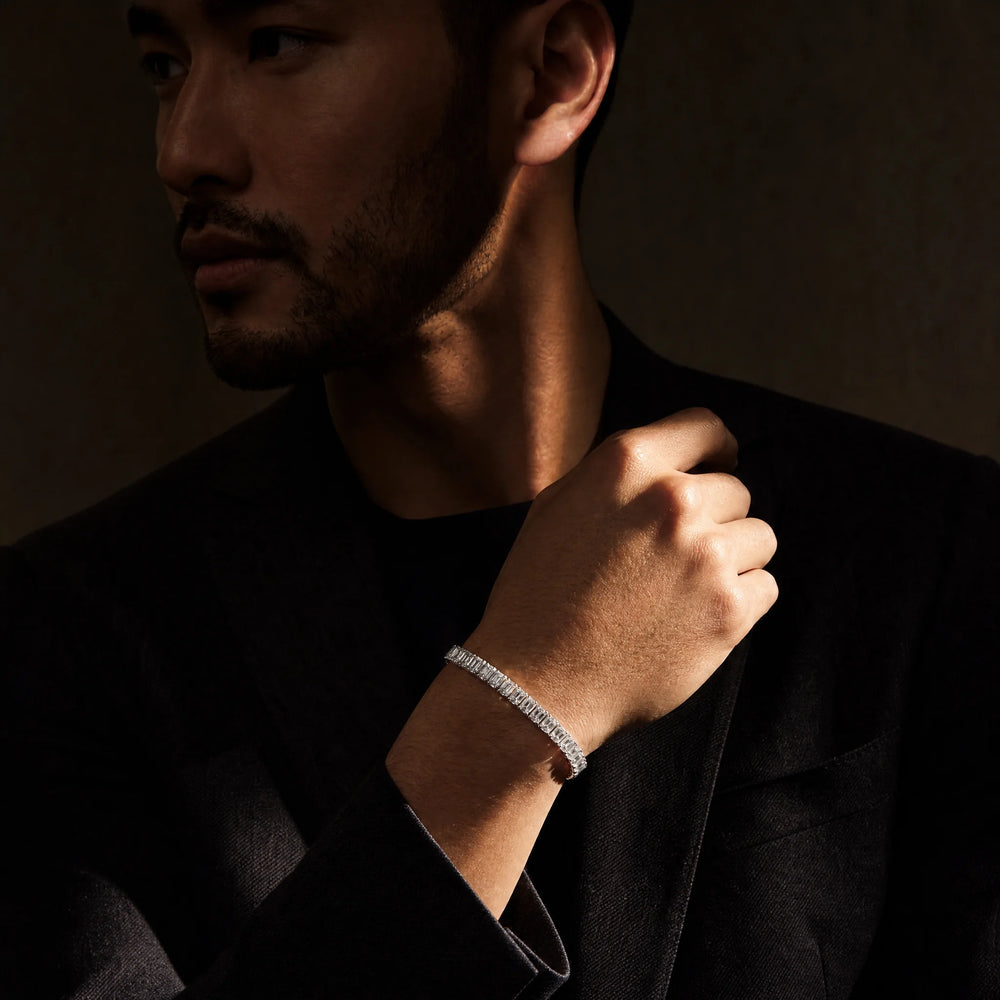 Man wearing the Meridian emerald-cut tennis bracelet on his wrist, Carat Club Co.